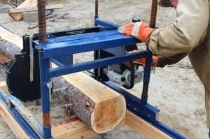 making a cut with the portable sawmill