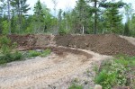 The mountain of clay excavated from the pond