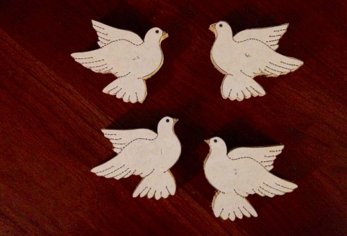 doves cut from white cedar wood