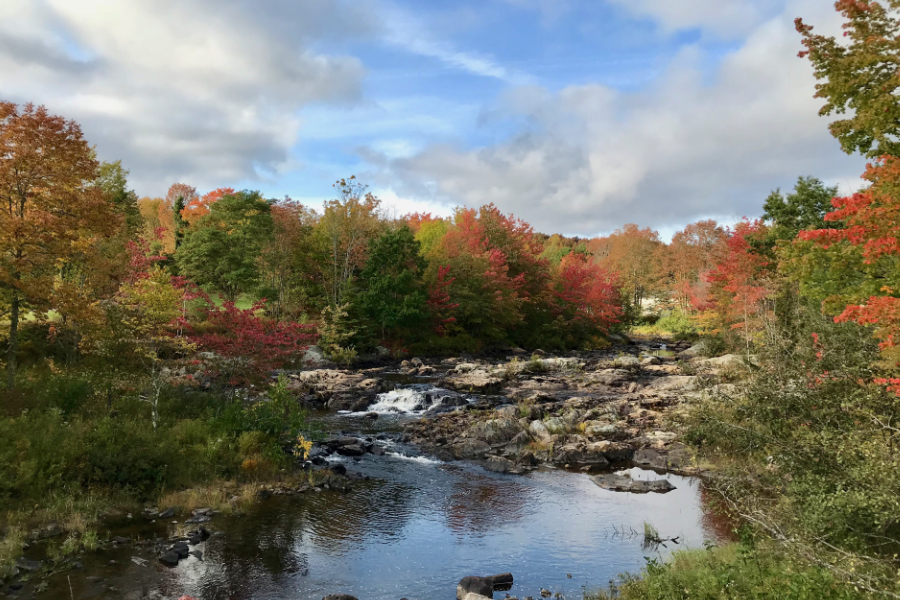 clouds breaking up over the river