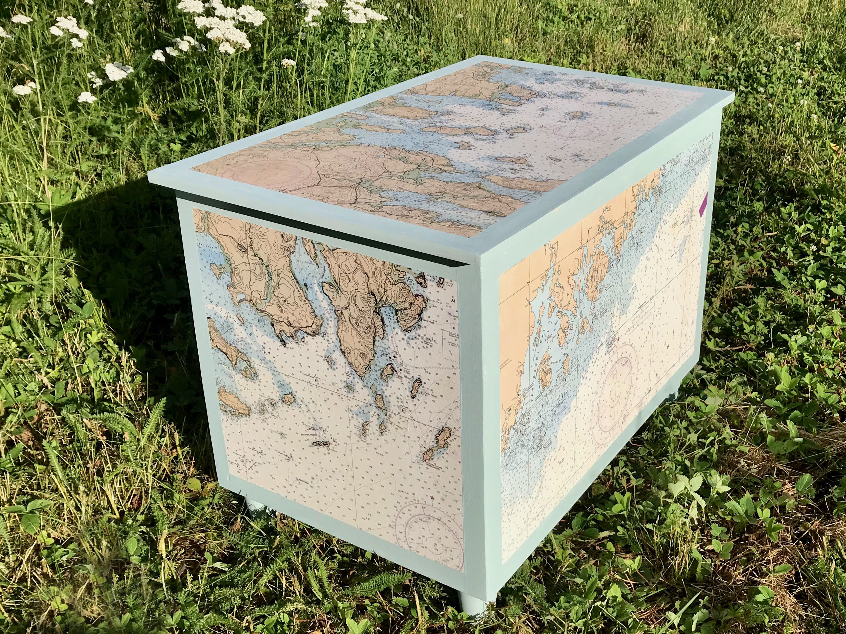 coffee table with nautical charts