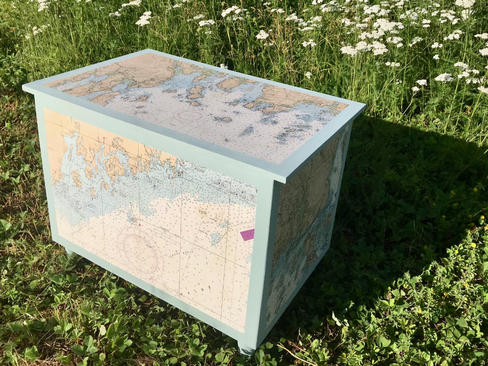 coffee table with nautical charts